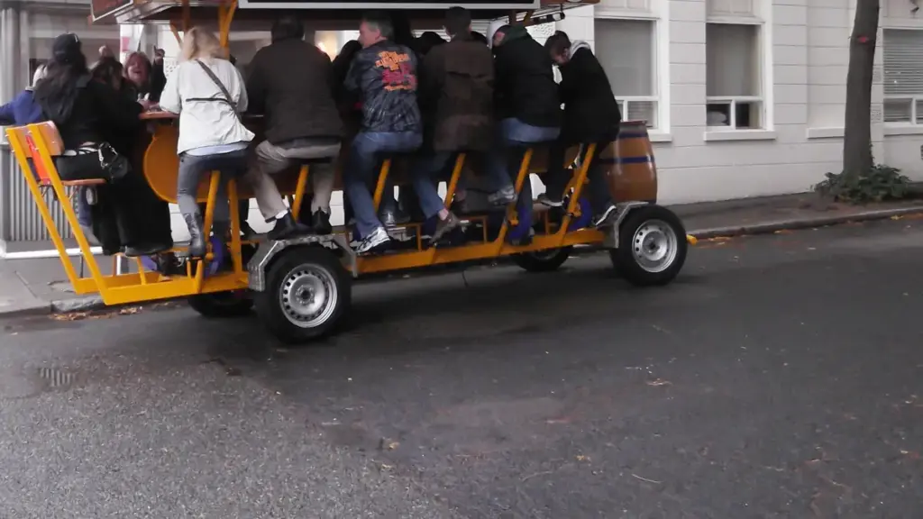 Open-air pedal tavern carrying multiple passengers along a city street, similar to the vehicle involved in the Nashville crash