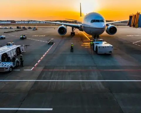 Commercial jet aircraft landing on an airport tarmac runway during flight operations