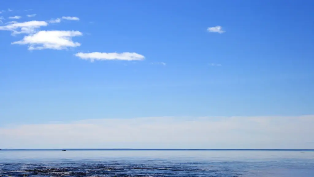 A small vessel on Lake Superior under open sky.