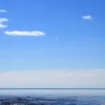 A small vessel on Lake Superior under open sky.
