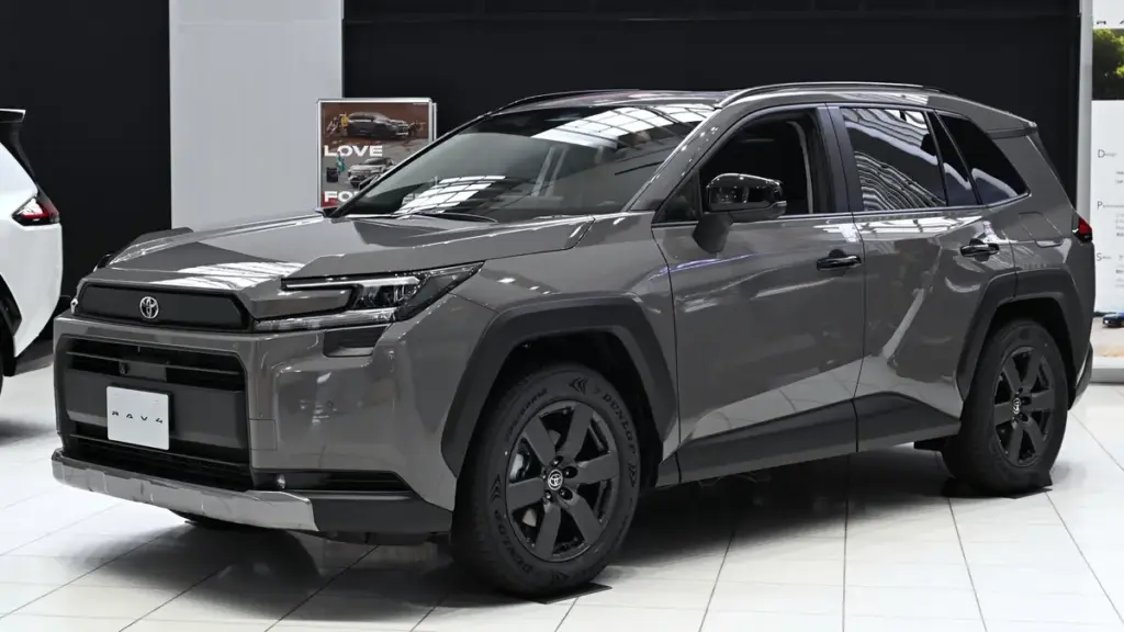 Front three-quarter view of a modern Toyota RAV4 Hybrid crossover parked on pavement.