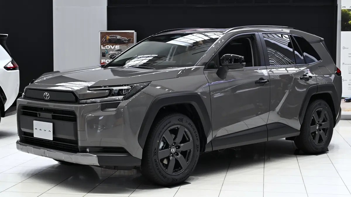 Front three-quarter view of a modern Toyota RAV4 Hybrid crossover parked on pavement.