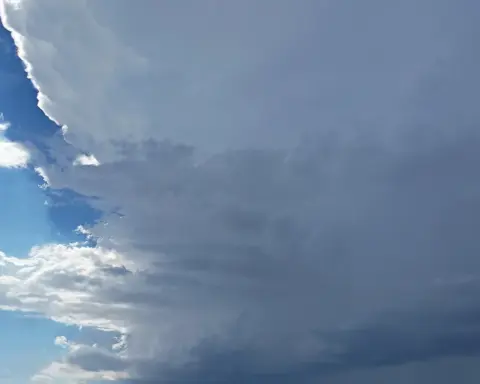 Dark supercell thunderstorm clouds building over the landscape, similar to the system that struck northern Arizona