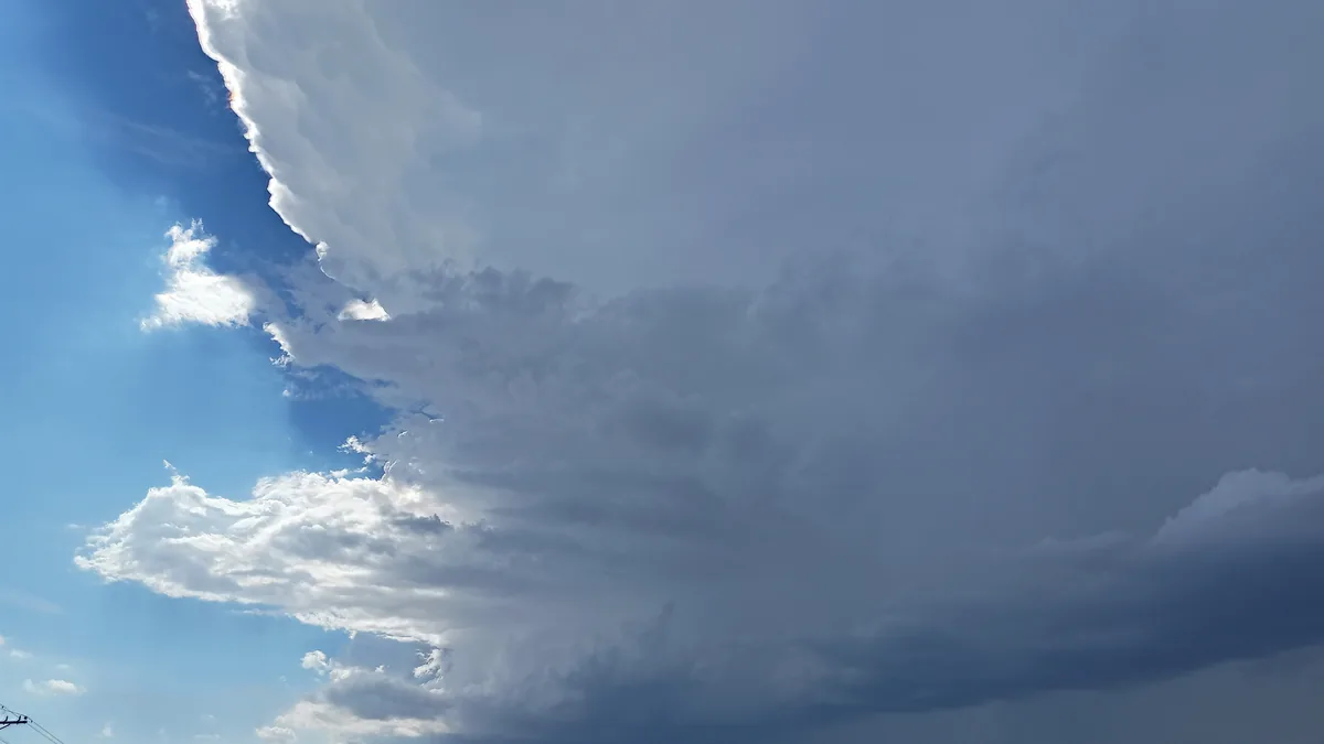 Dark supercell thunderstorm clouds building over the landscape, similar to the system that struck northern Arizona