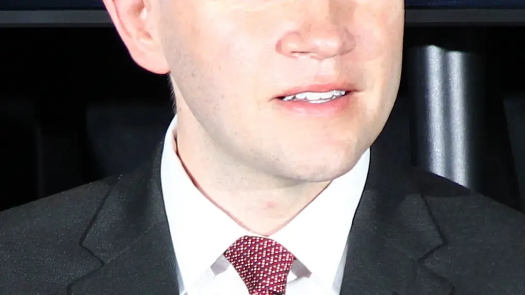 Texas State Representative James Talarico speaking into a microphone at an open civic conference in Austin, Texas
