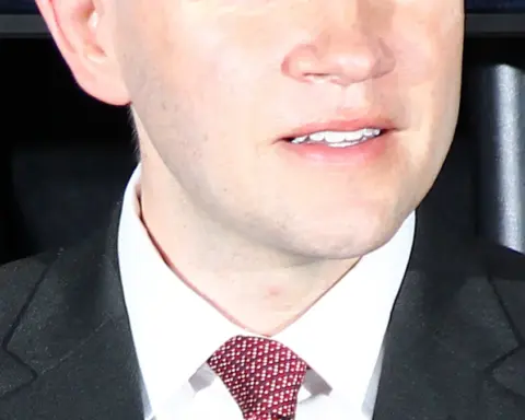 Texas State Representative James Talarico speaking into a microphone at an open civic conference in Austin, Texas