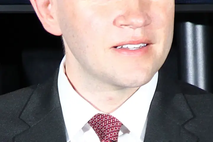 Texas State Representative James Talarico speaking into a microphone at an open civic conference in Austin, Texas