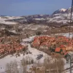 Snow-covered runs and buildings at Telluride Ski Resort in Colorado.