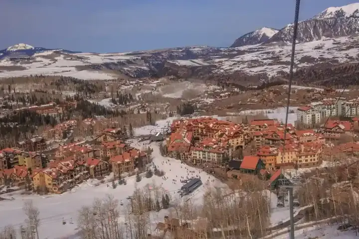 Snow-covered runs and buildings at Telluride Ski Resort in Colorado.