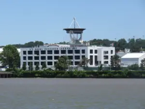 The U.S. Naval Research Laboratory in Washington D.C., a modern research facility with satellite dish and river access.