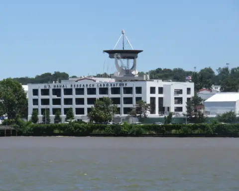The U.S. Naval Research Laboratory in Washington D.C., a modern research facility with satellite dish and river access.