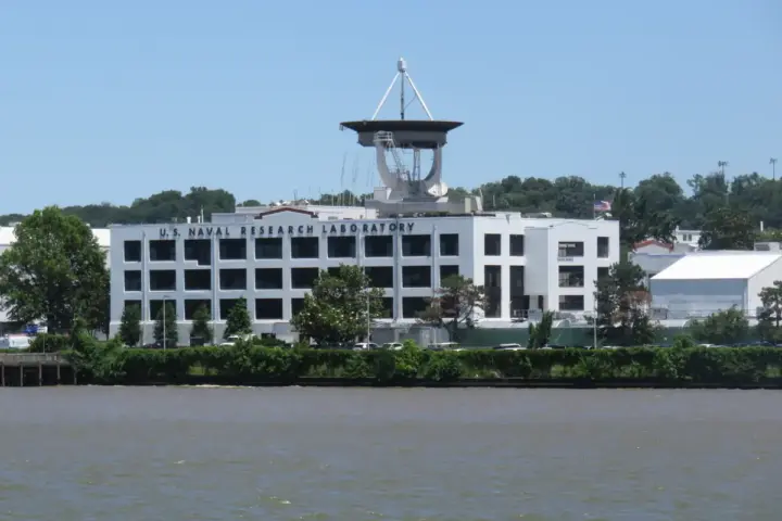 The U.S. Naval Research Laboratory in Washington D.C., a modern research facility with satellite dish and river access.