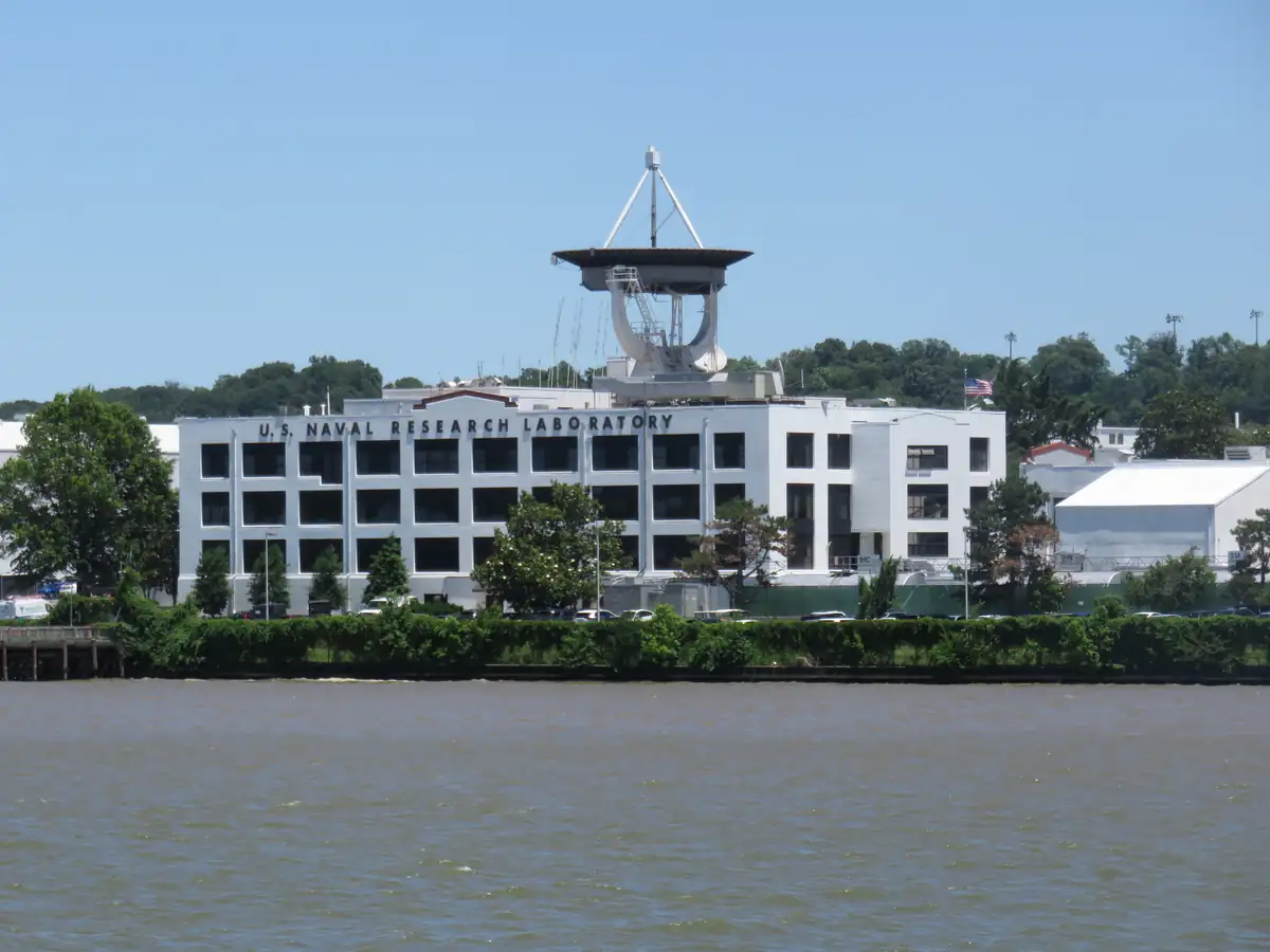 The U.S. Naval Research Laboratory in Washington D.C., a modern research facility with satellite dish and river access.