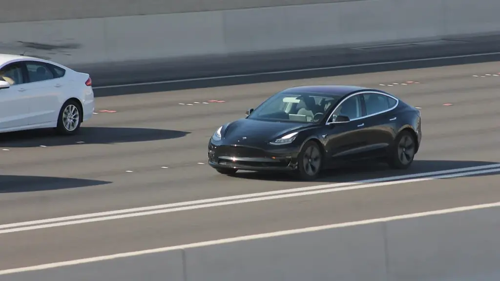 Tesla Model 3 driving on a public road