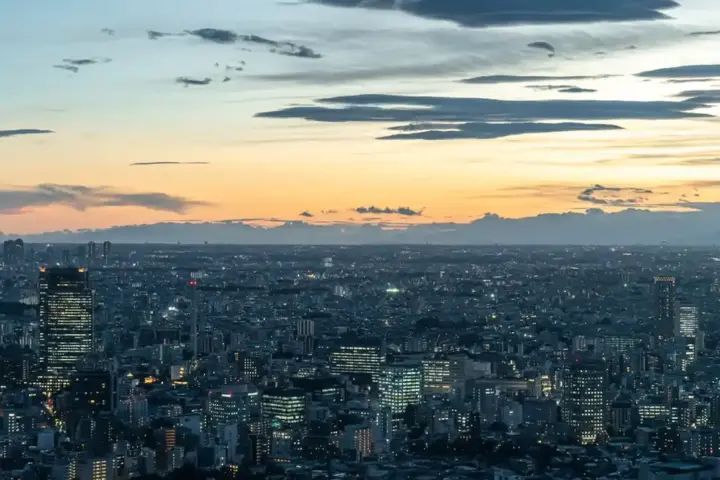 Tokyo skyline at dusk with illuminated skyscrapers