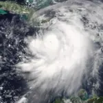 Satellite view of a tropical storm system over the ocean.