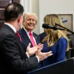 President Donald Trump and Michael Dell with officials during a Trump Accounts announcement at the White House.