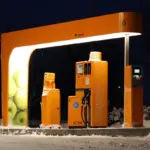 A heavy-duty automated diesel fuel pump nozzle at a filling station.