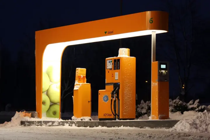 A heavy-duty automated diesel fuel pump nozzle at a filling station.