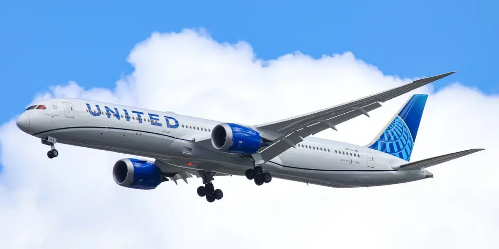 United Airlines Boeing widebody aircraft taxiing on an airport runway.