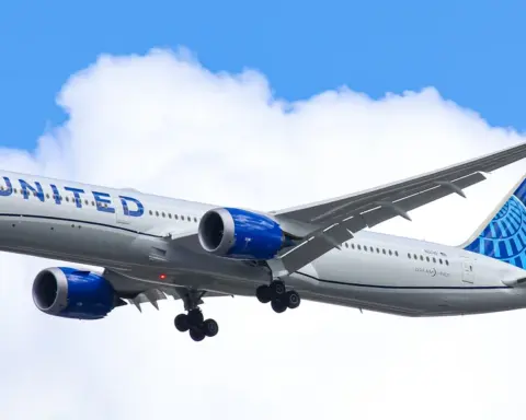 United Airlines Boeing widebody aircraft taxiing on an airport runway.