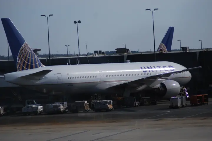 A United Airlines aircraft parked at an airport gate.