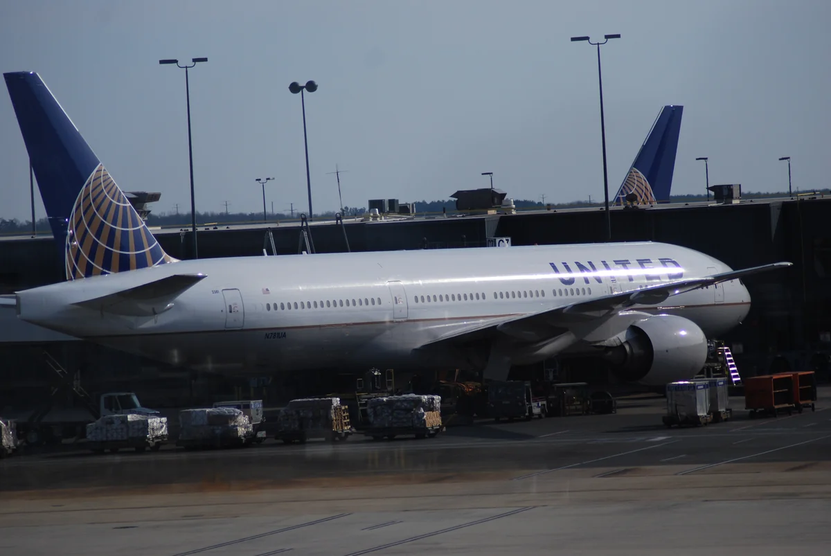 A United Airlines aircraft parked at an airport gate.