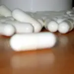 White capsules arranged on a tabletop, a representative image for a prescription thyroid medication recall notice.