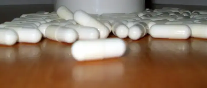 White capsules arranged on a tabletop, a representative image for a prescription thyroid medication recall notice.