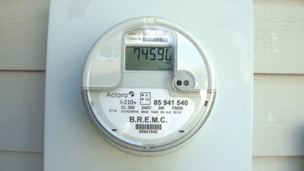 Close-up photograph of a wall-mounted single-phase smart digital electricity meter.