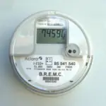 Close-up photograph of a wall-mounted single-phase smart digital electricity meter.